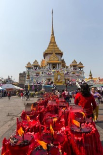 Row of candles at the Phra Maha Mondop of the Wat Traimit temple