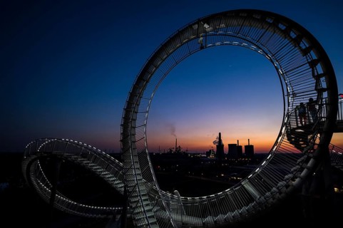 Power plant with part of the Tiger and Turtle sculpture at sunset