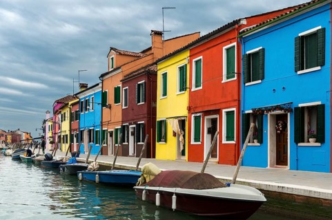 Colorful houses on canal with boats
