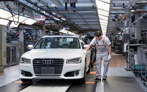 Audi AG employee conducting the first run of an assembled A8 sedan