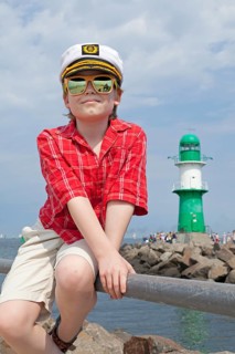 Young boy with a captain's hat