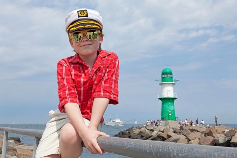 Young boy with a captain's hat
