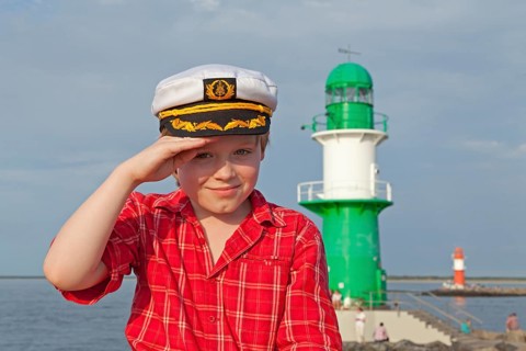 Young boy with a captain's hat