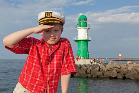 Young boy with a captain's hat