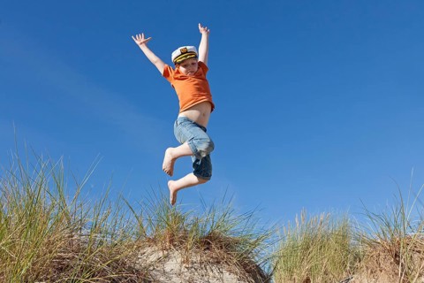 Boy wearing captain's hat