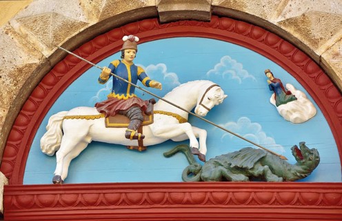 Wooden relief on the portal of the parish church of St. George