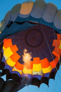 Pilot inflating hot air balloon with two burners
