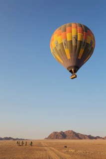 Hot-air balloon just taken-off in the early morning