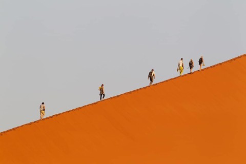 Tourists climbing Dune 45 in the Namib Desert
