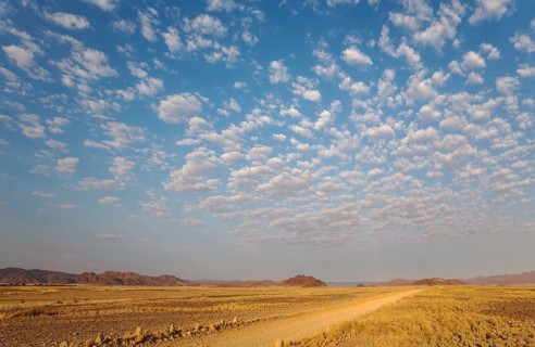 Gravel road on arid plain