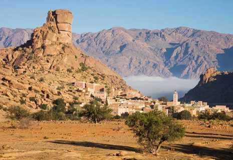 The village of Aguard Oudad at the foot of the famous rock formation Chapeau de Napoleon
