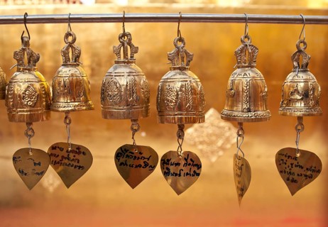 Golden bells hanging from a pole as an sacrifice