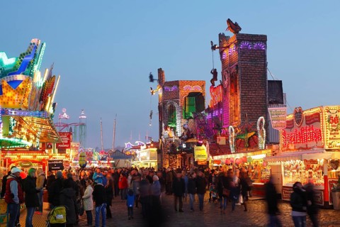 Ghost train Spuk on the fun fair Bremer Freimarkt at dusk