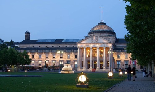 Spa hotel with fountain and park Bowling Green at dusk