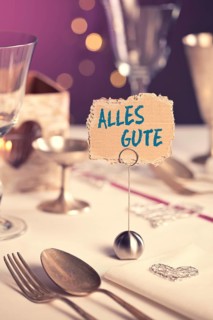 Note on festive table with the inscription Alles Gute or Best Wishes