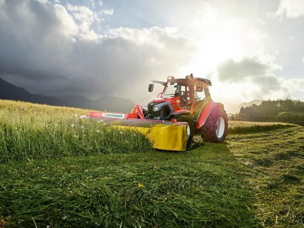 Tractor mowing a field