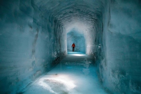 Tourist in a glacial cave