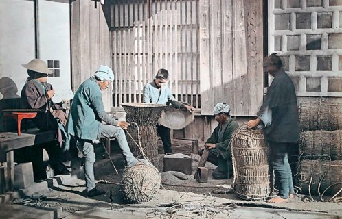 Farmers producing rice bundles