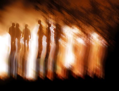 Shadowy outlines of several people in front of fire