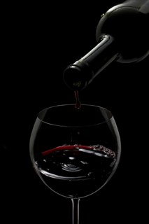 Red wine being poured into a glass