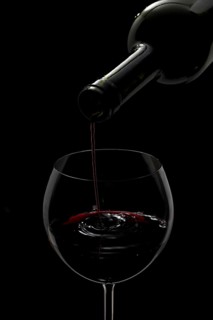 Red wine being poured into a glass
