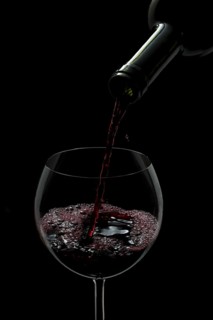 Red wine being poured into a glass