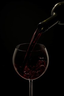 Red wine being poured into a glass