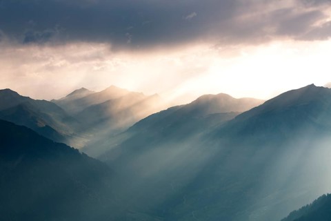 Landscape with sunbeams on the Diedamskopf with view towards Kanisfluh and Damuls