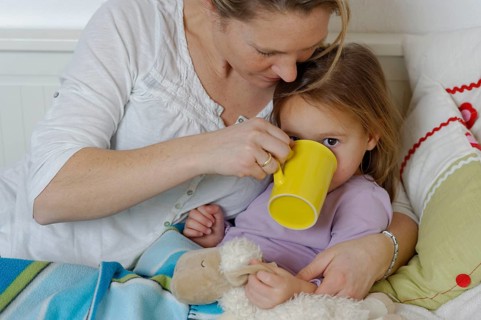 Mother taking care of her sick daughter