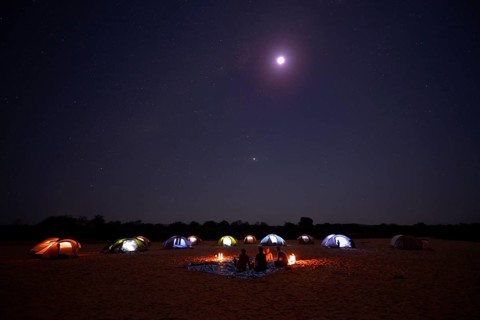 A camp on the Tsiribihina River at night