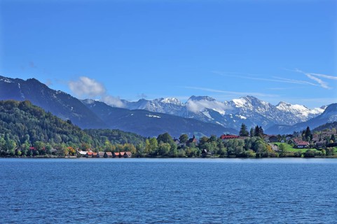 Snow-covered Oberstdorf Mountains behind Buhl am Alpsee with Alpsee lake