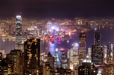 Panoramic view from Victoria Peak across the high-rise buildings at night