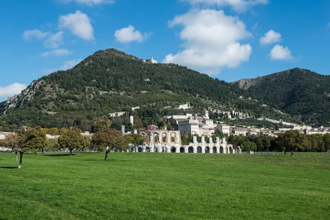 Historic town of Gubbio with Monte Ingino and the Roman theatre