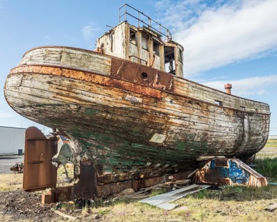 Old fishing boat on land