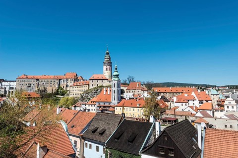 View of Cesky Krumlov Castle and the Church of St. Jost on the Vltava River