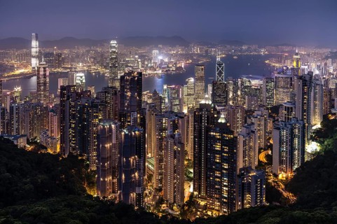 Panoramic view from Victoria Peak across the high-rise buildings at night