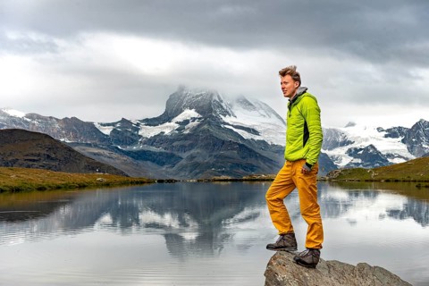 Hiker stands on rock