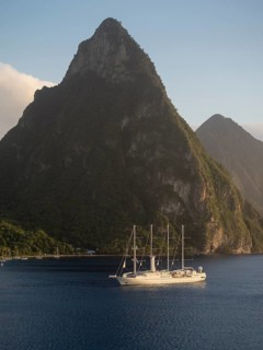 Sailing cruise ship Wind Star of Windstar Cruises in front of the volcanoes Gros Piton and Petit Piton