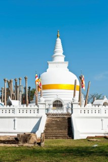 Old white stupa with orange ribbon
