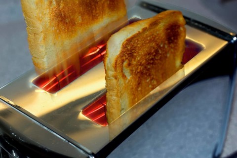 Toast slices flying out of the toaster