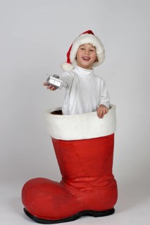 Boy with small gift in a Christmas boot