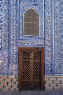 Door and mosaic-decorated wall