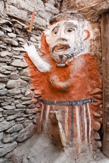 Animistic figure as a guard at the entrance to a house