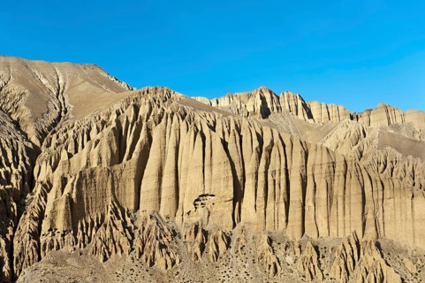 Bizarre erosion landscape with prehistoric caves in the rocks