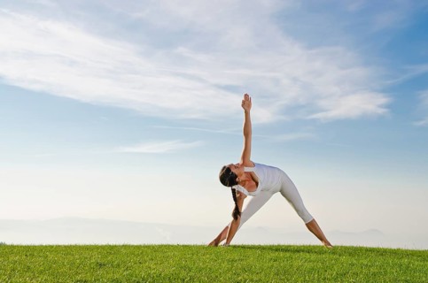 Young woman practising Hatha yoga
