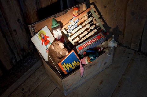 Old toys in a wooden chest
