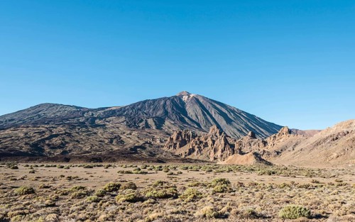 Pico del Teide or Mount Teide with the rock formation Roques de Garcia