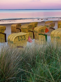 Beach chairs on the beach at dusk
