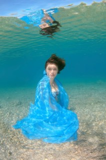 Underwater model presenting fashion in the sea