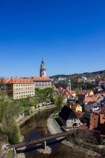 Cesky Krumlov Castle with the castle tower and St. Jost Church